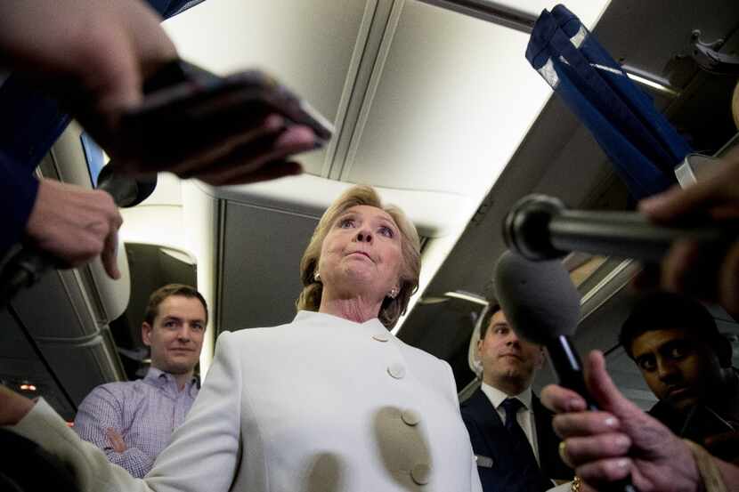 Democratic presidential candidate Hillary Clinton, center, accompanied by Campaign Manager...