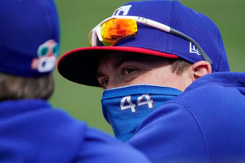 Texas Rangers pitcher Kyle Gibson watches from the dugout during the first inning of a...