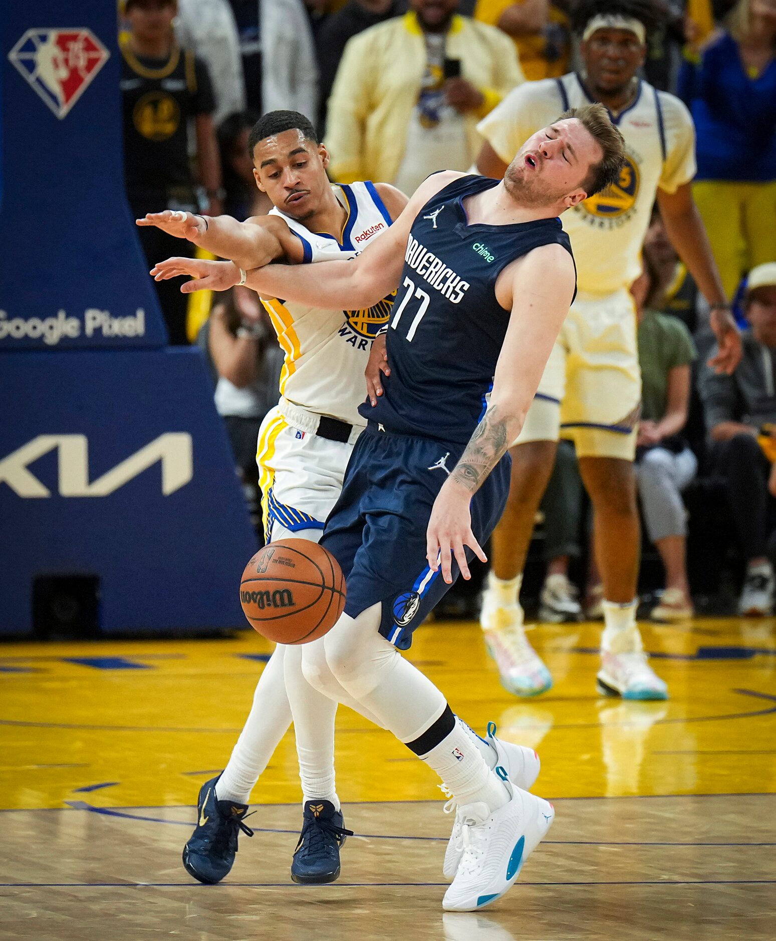 Dallas Mavericks guard Luka Doncic (77) is fouled by Golden State Warriors guard Jordan...