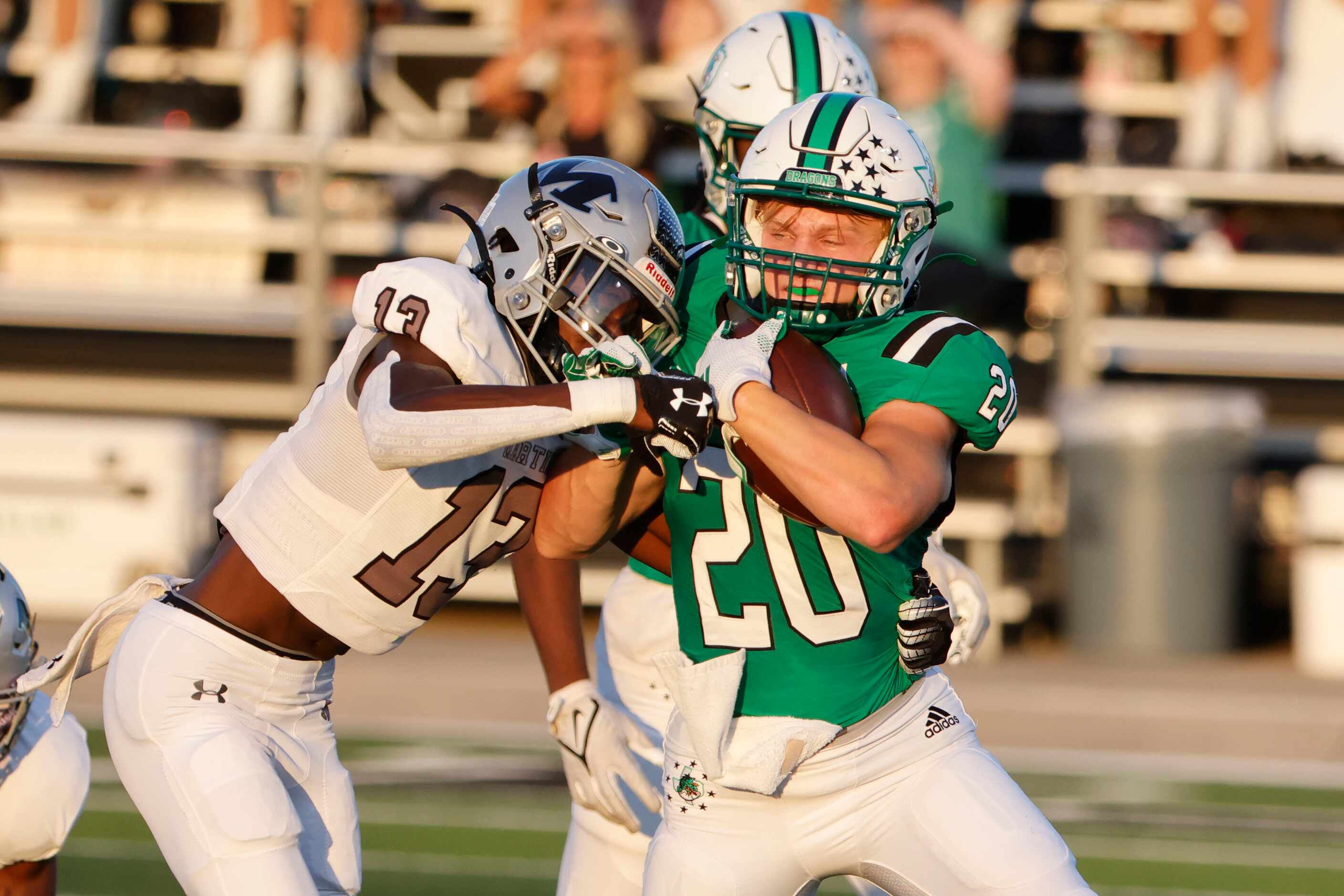 Arlington Martin defender Josiah Charles (13) tackles Southlake Carroll running back James...