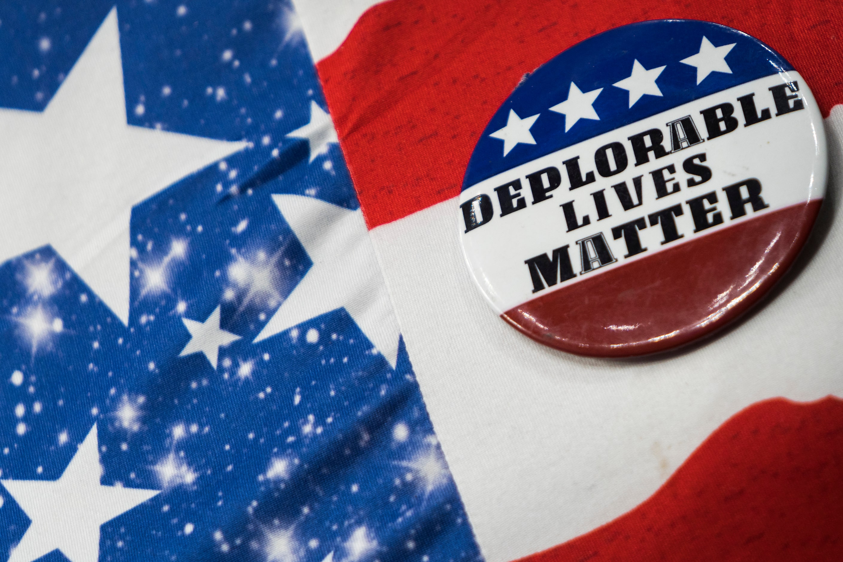 A supporter wears a button reading “Deplorable Lives Matter” as President Donald Trump...