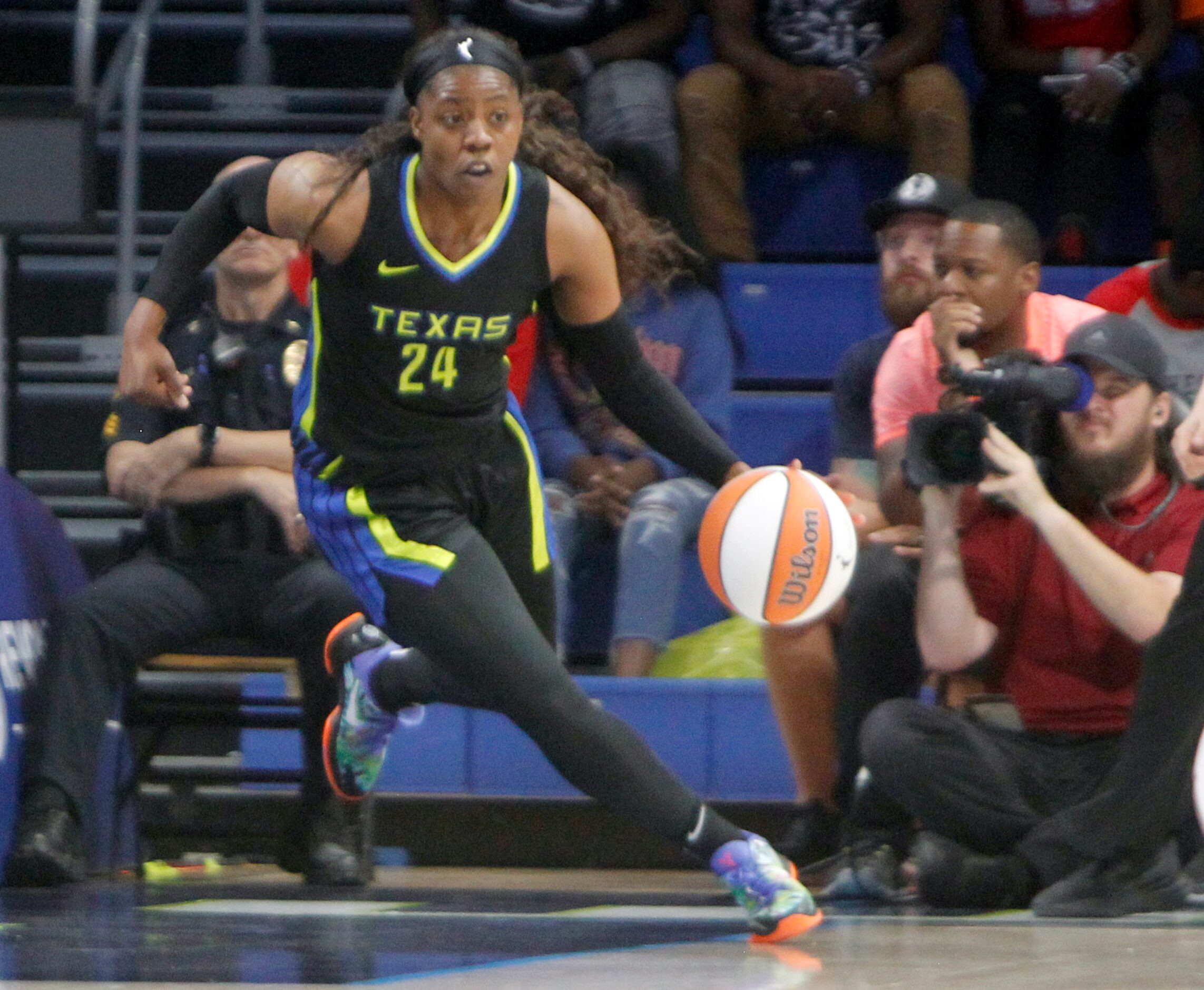 Dallas Wings guard Arike Ogunbowale (24) pulls down a rebound and moves to set up an...