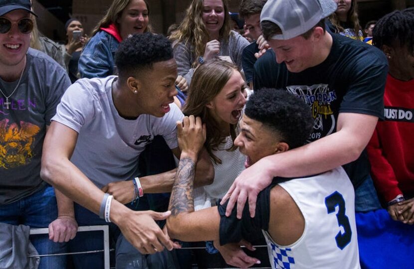 Wildcats player Keaston Willis (3) celebrates with fans after his team won the Class 5A...