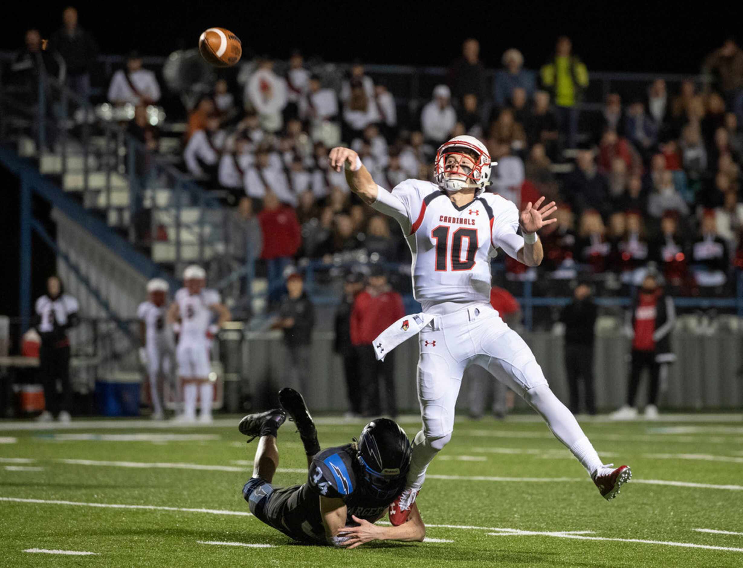 Fort Worth Christian senior quarterback Carson Cross (10) just gets a pass off ahead of the...