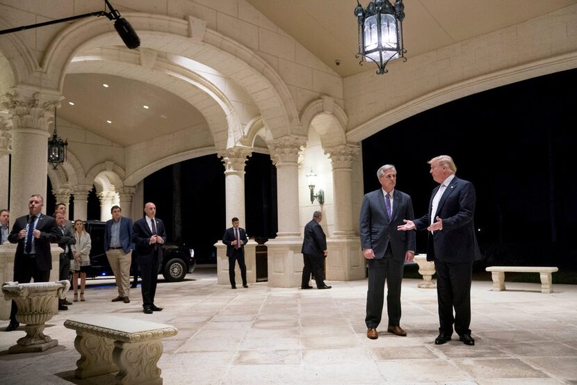 President Donald Trump looks at House Majority Leader Kevin McCarthy of Calif., as he speaks...