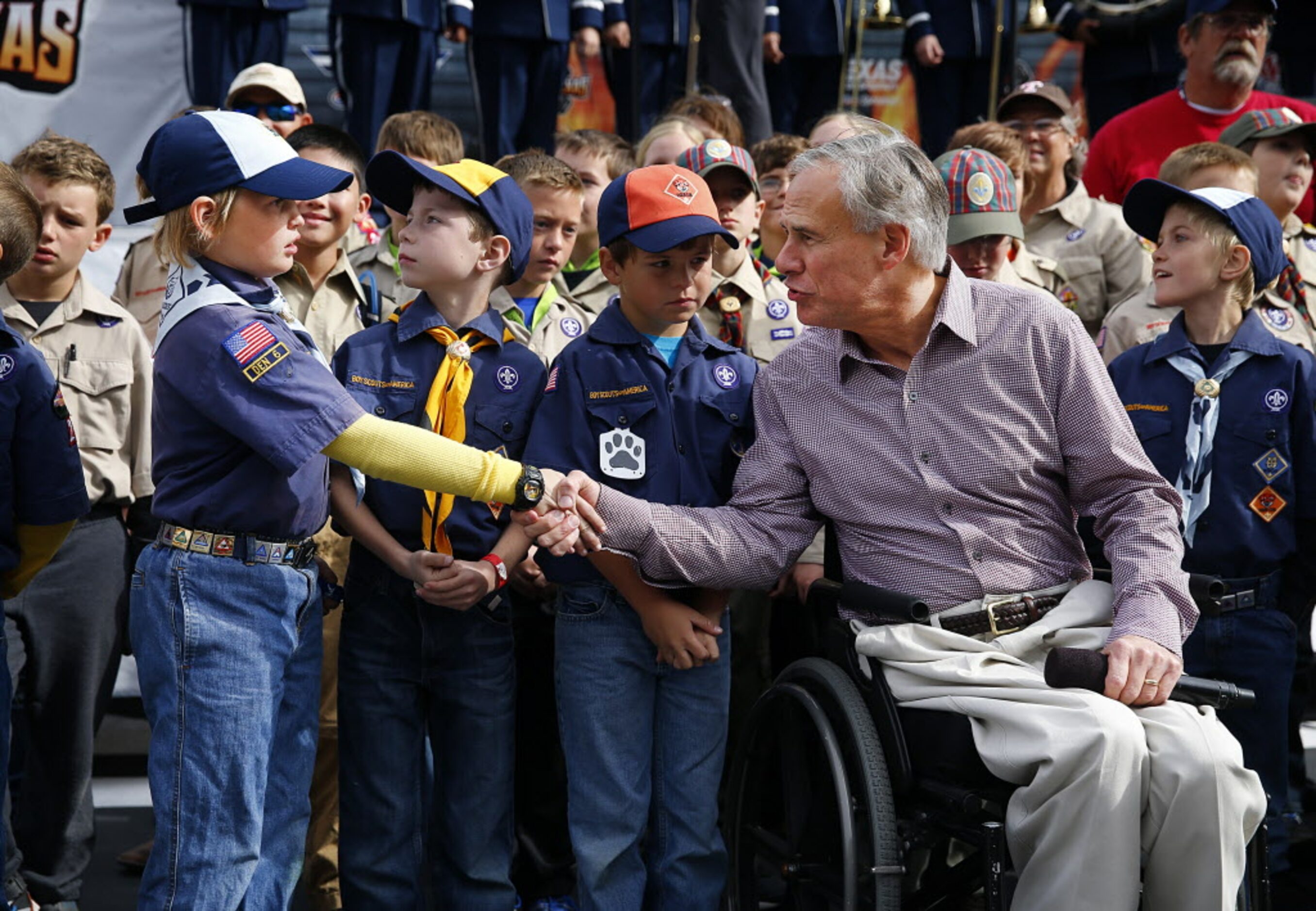 Republican Gubernatorial candidate and Texas Attorney General Greg Abbott shakes hands with...