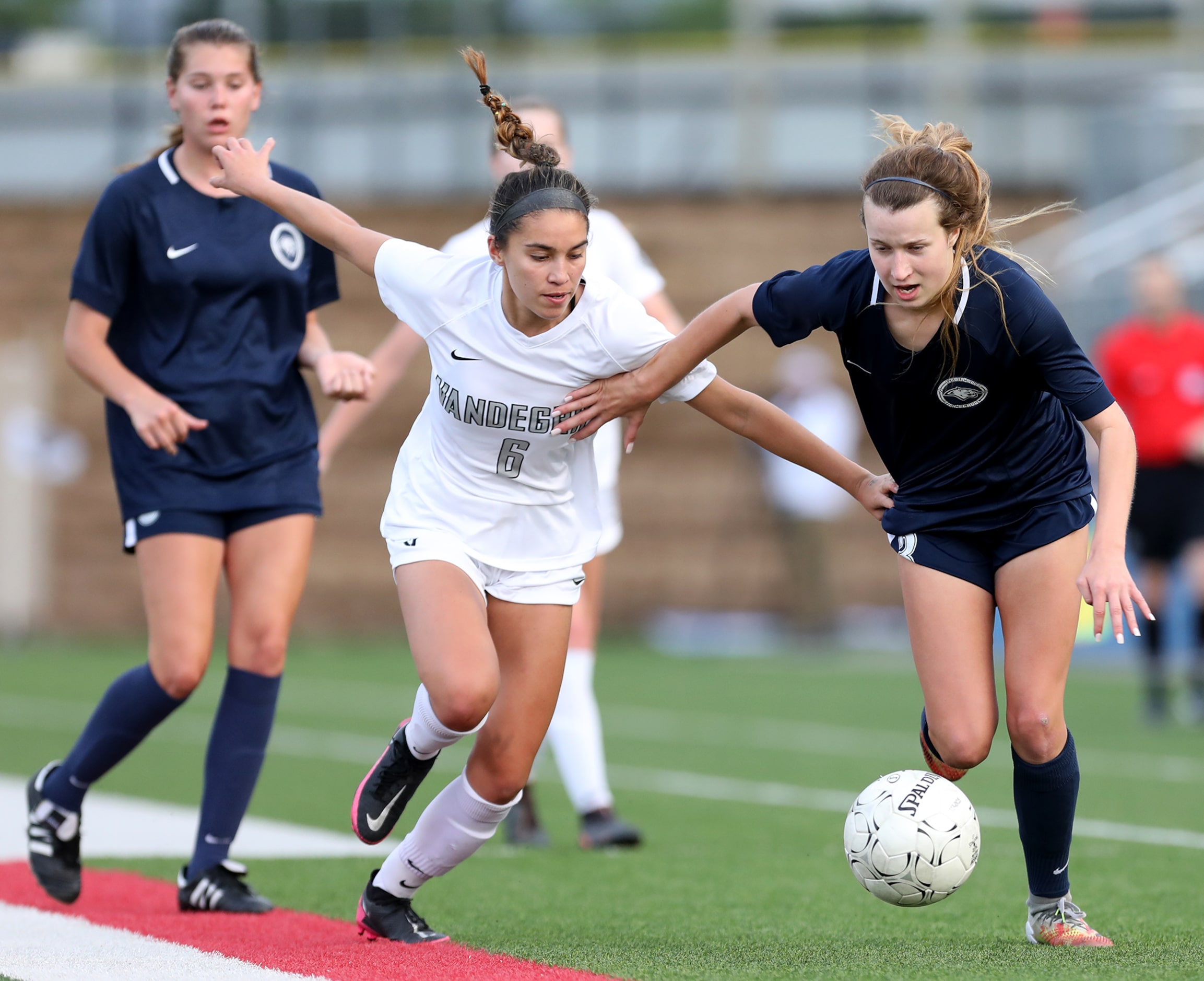 Lewisville Flower Mound's Tatum Beck (3) and Austin Vandegrift's Hailey Sapinoro (6) chase...