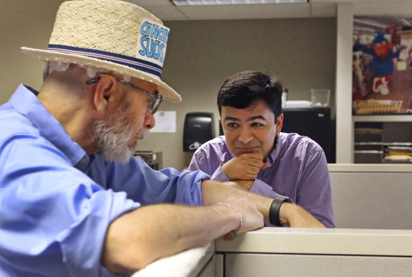 Jeffrey Weiss talks with Andrew Chavez as he makes the rounds at The Dallas Morning News in...