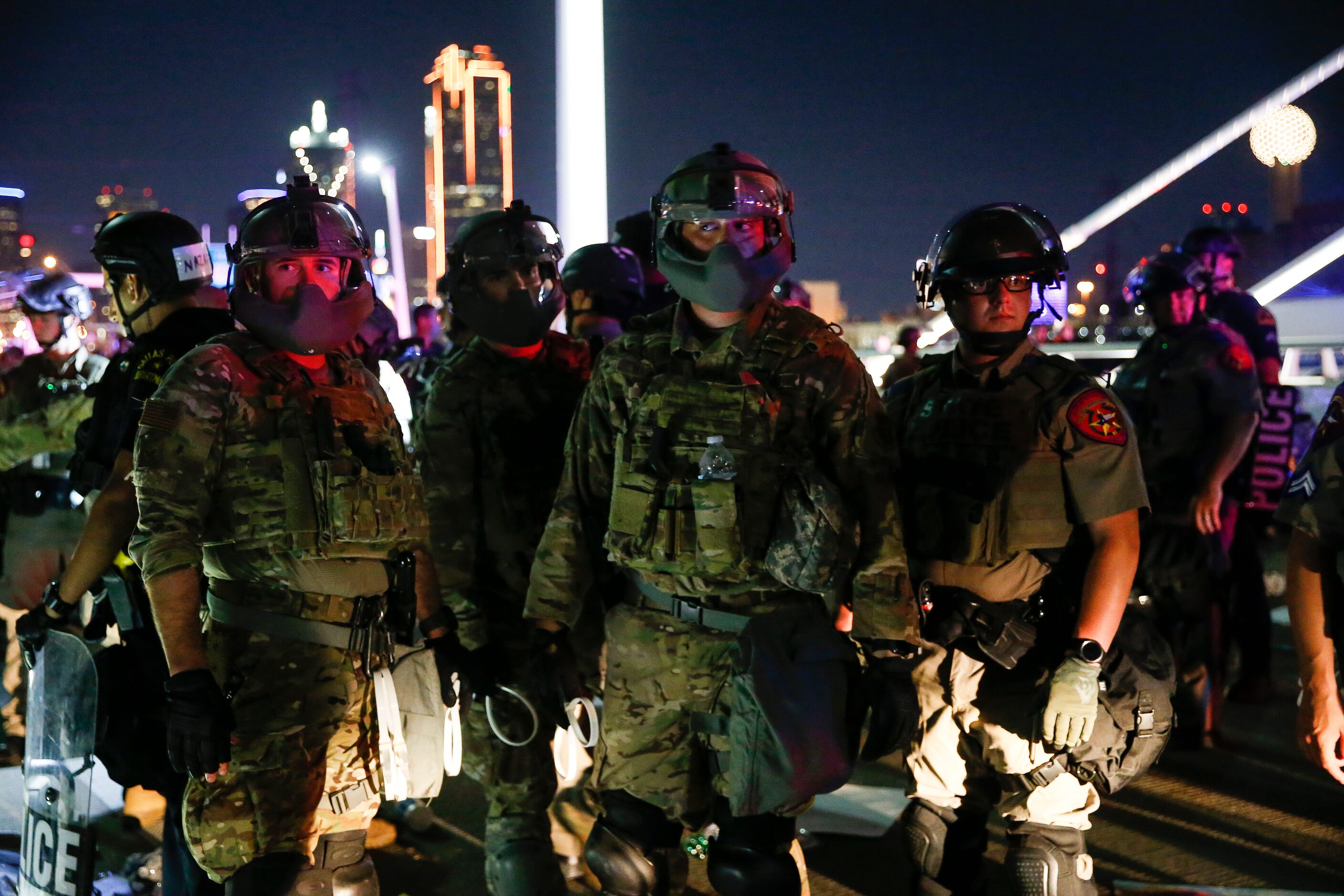 Police surround and detain hundreds of protesters who marched onto the Margaret Hunt Hill...