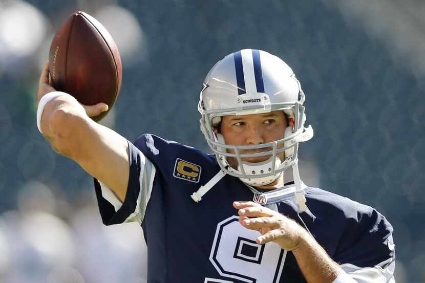 Dallas Cowboys quarterback Tony Romo (9) throws the ball during warm ups before a game...