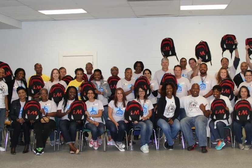  VHA employees with Irving students. Photo courtesy of Irving ISD.