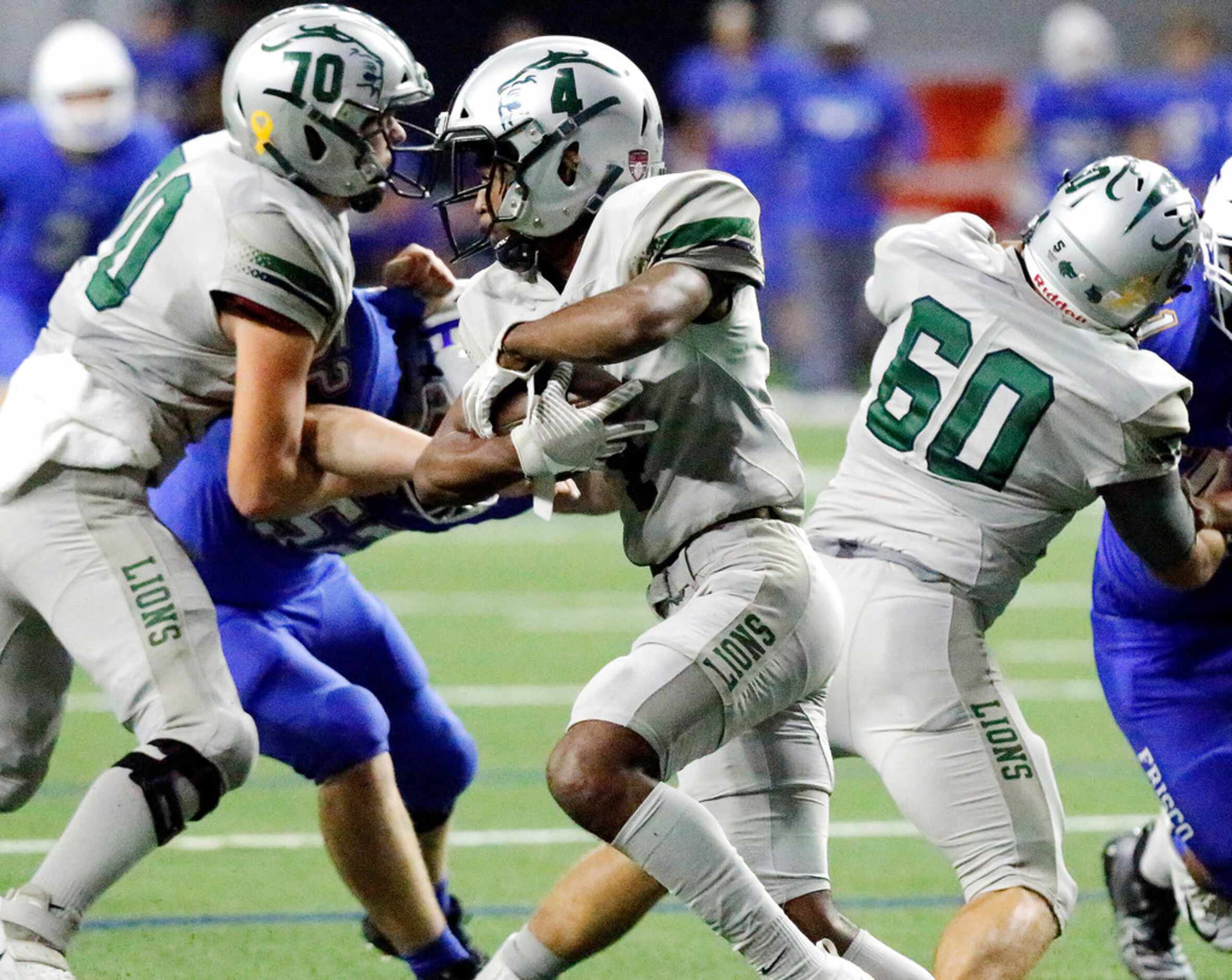 Reedy High School running back Jacob Smith (4) carries the ball during the first half as...