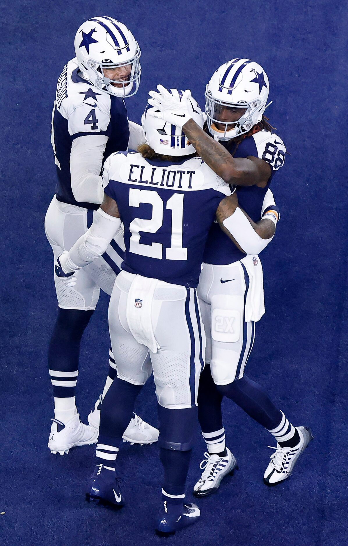 Dallas Cowboys wide receiver CeeDee Lamb (88) and quarterback Dak Prescott (4) congratulate...