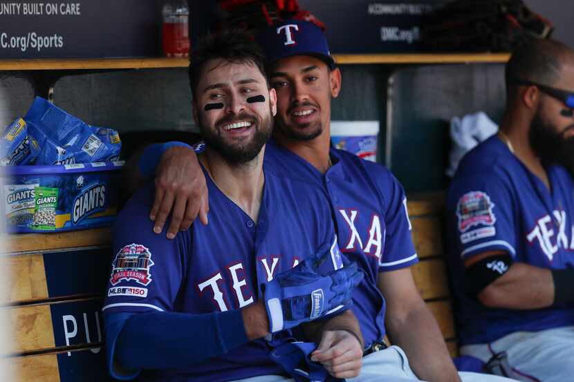 Texas Rangers' Joey Gallo, left, celebrates his solo home run with Ronald Guzman in the...