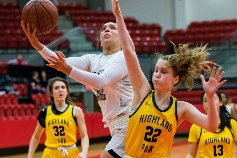 Frisco Lone Star's Victoria Gooden takes a shot over Highland Park's Cate Rhodes (22) during...