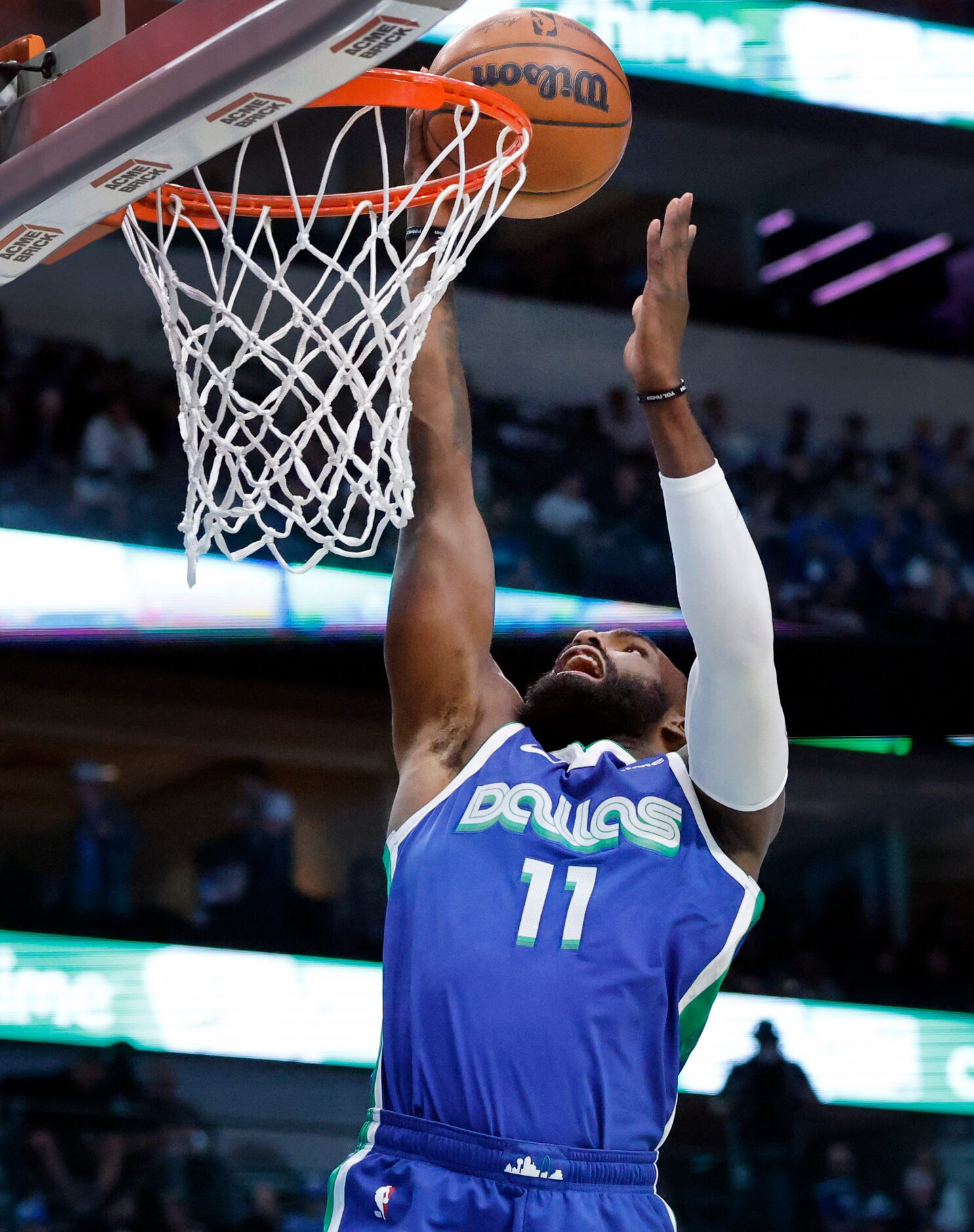 Dallas Mavericks forward Tim Hardaway Jr. (11) lays up a shot against the Sacramento Kings...