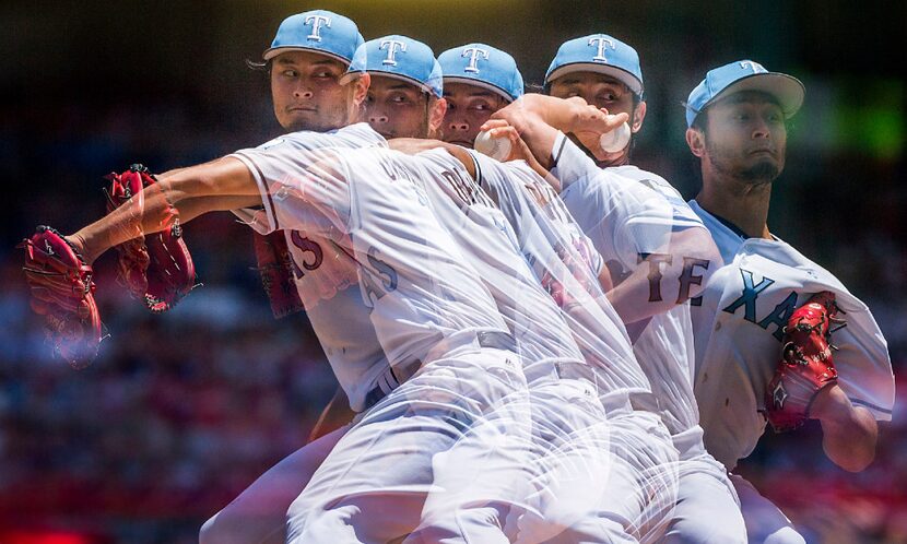 A multiple exposure photograph shows Texas Rangers starting pitcher Yu Darvish as he pitched...