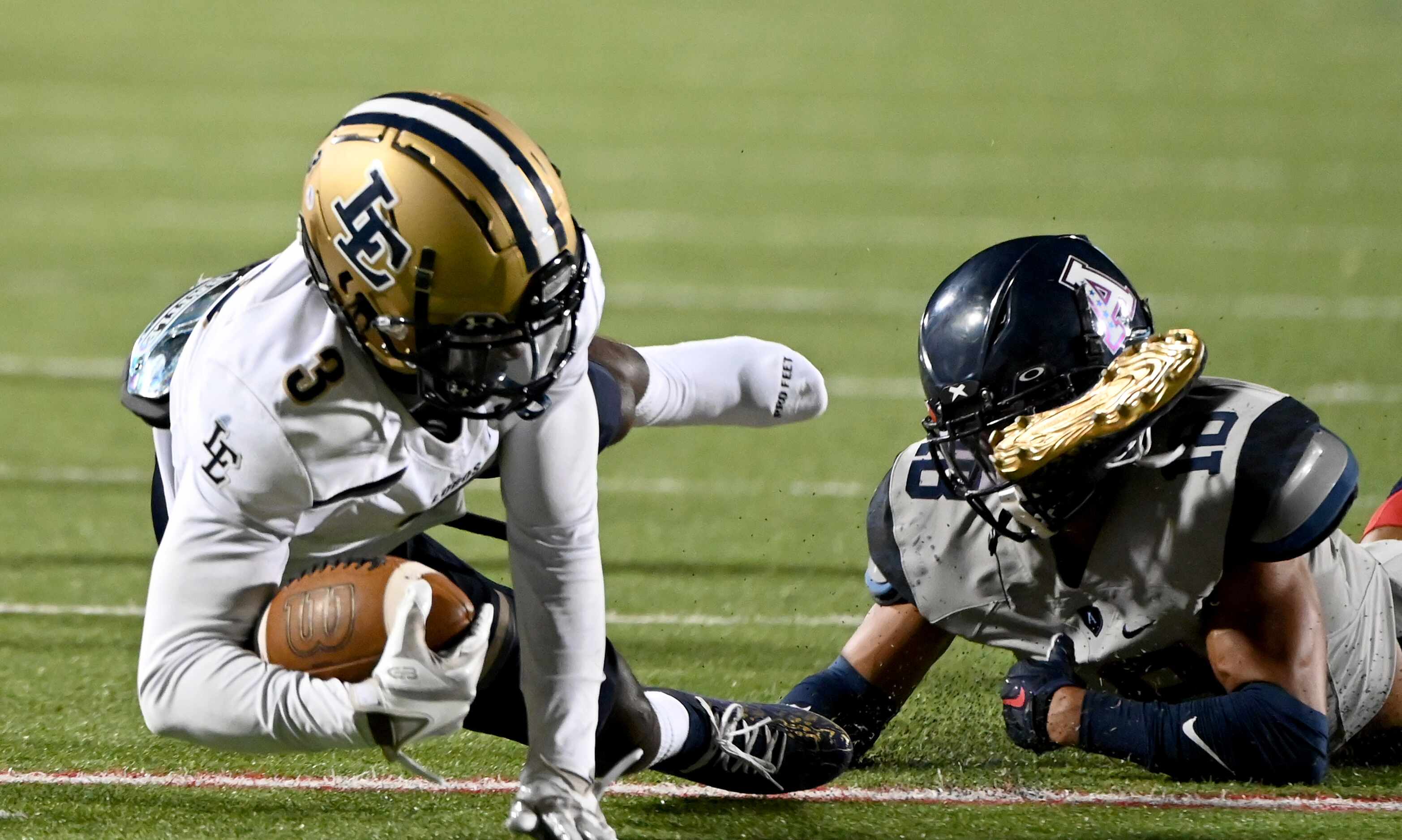 Little Elm’s Vashawn Thomas II (3) loses his shoe as he is tackled by Allen’s Malakai...