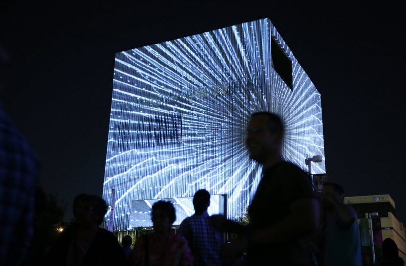 A light show by 3_Search on display on the Wyly Theatre during Aurora, an interactive art...