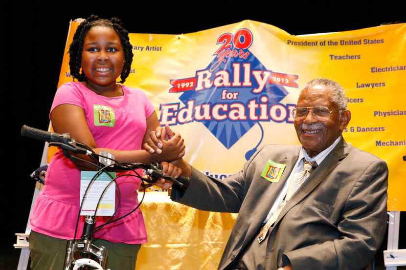 Eryn Tucker-Green, 10, poses with Judge L. Clifford Davis after winning first place in...