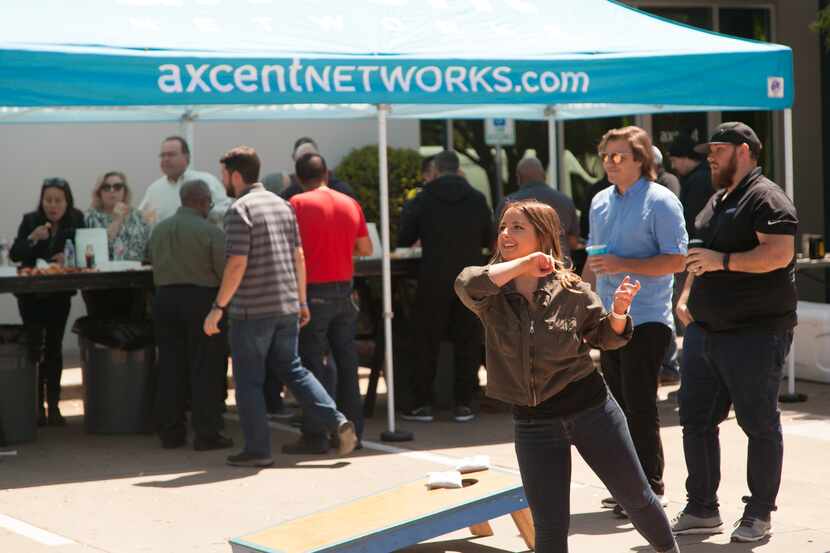 Axcent Networks Inc. workers played games at the company's crawfish boil in 2019.