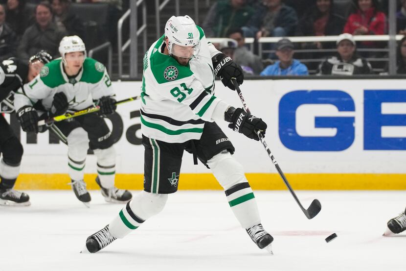 FILE -- Dallas Stars center Tyler Seguin (91) shoots and scores during the first period of...