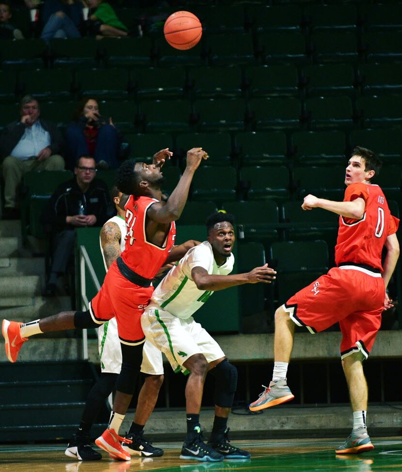 North Texas junior guard Deckie Johnson (10) watches with Sam Houston State junior forward...