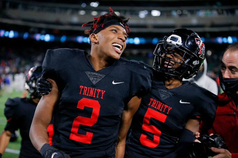 Euless Trinity junior running back Ollie Gordon (2) and junior defensive back Jayveus Lyons...