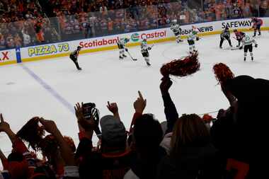 Edmonton Oilers fans cheer in the third period during Game 4 of the NHL hockey Stanley Cup...