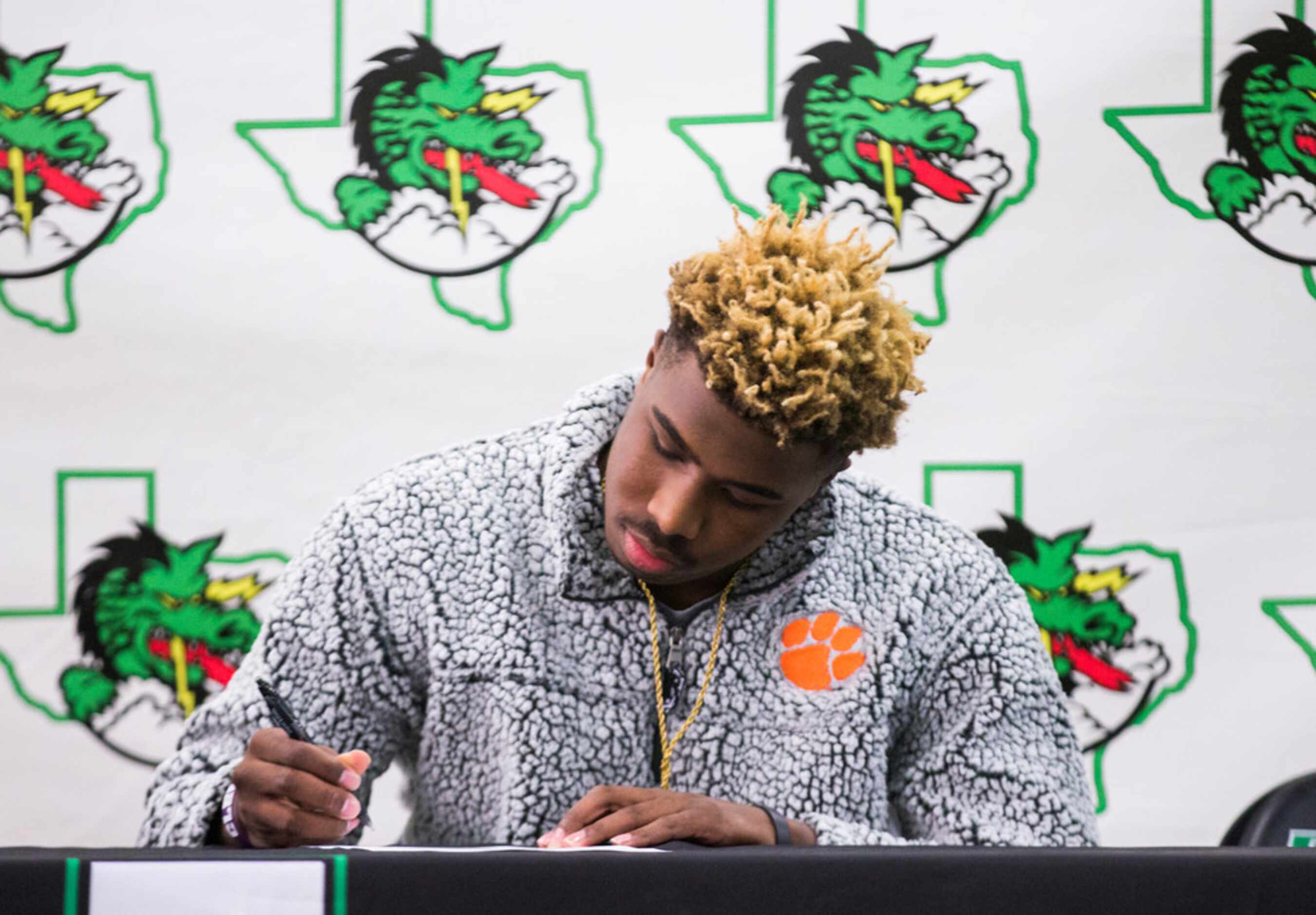 Southlake Carroll football player RJ Mickens signs a national letter of intent to attend...