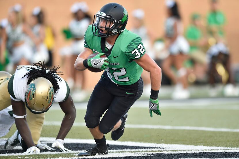 North Texas sophomore wide receiver Michael Lawrence (32) catches a pass from North Texas...