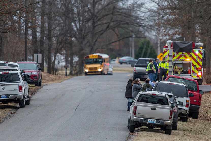 Emergency crews respond to Marshall County High School after a fatal school shooting Jan. 23...