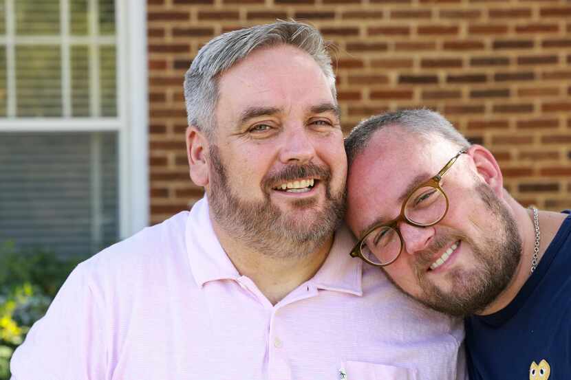 James Miller, 48, and Ricky Morrison, 40, pose for a portrait together at their home,...