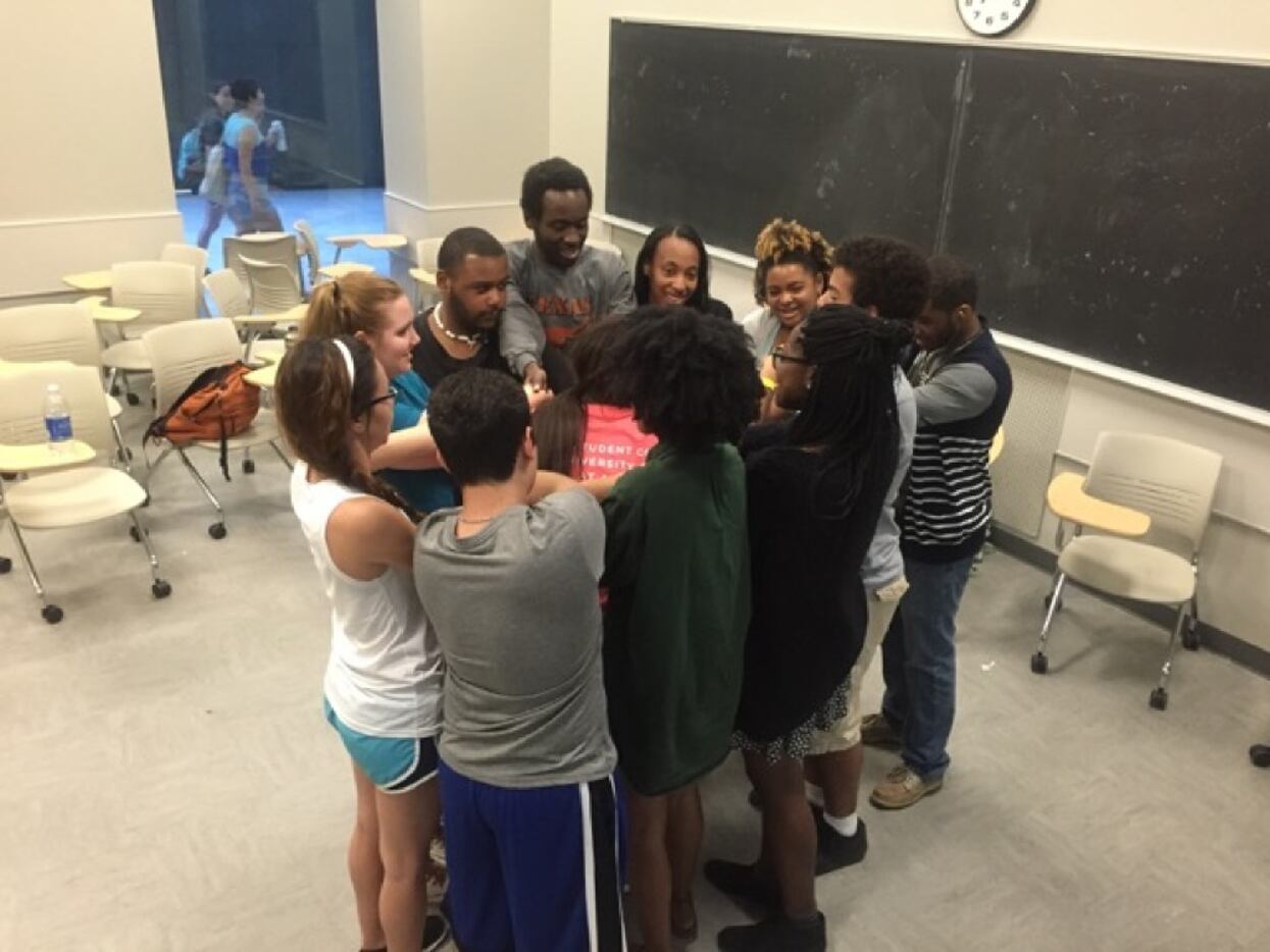 UT biology major Kendrex White (third from left, in black) participated in an icebreaker...