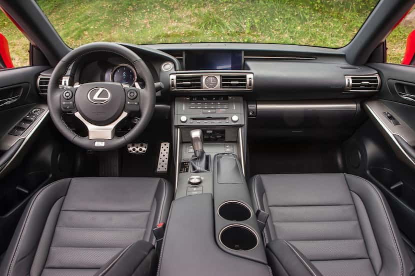 The console’s arch  up to the base of the display screen gives the interior of the Lexus IS...