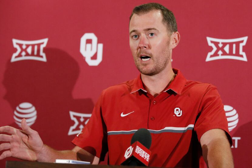 Oklahoma head coach Lincoln Riley answers a question during an NCAA college football news...