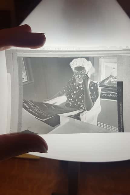 Head researcher Mary Fraser works on a story in this undated negative.