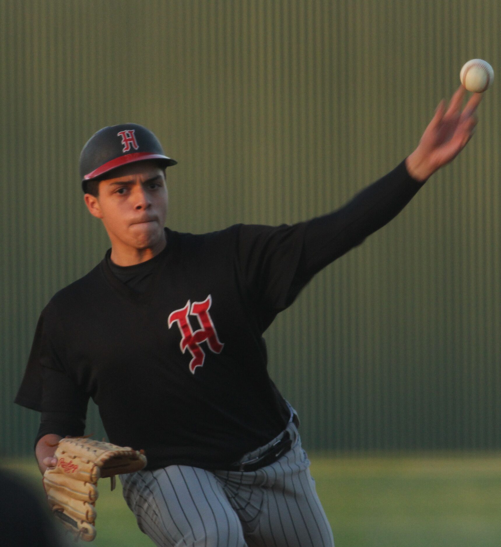 Dallas Hillcrest pitcher Steven Santoyo (25) delivers a pitch to a Carrollton Creekview...