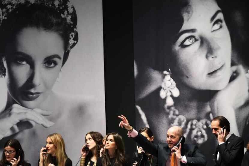 
Christie’s employees took bids during an auction of Elizabeth Taylor’s jewelry in 2011....