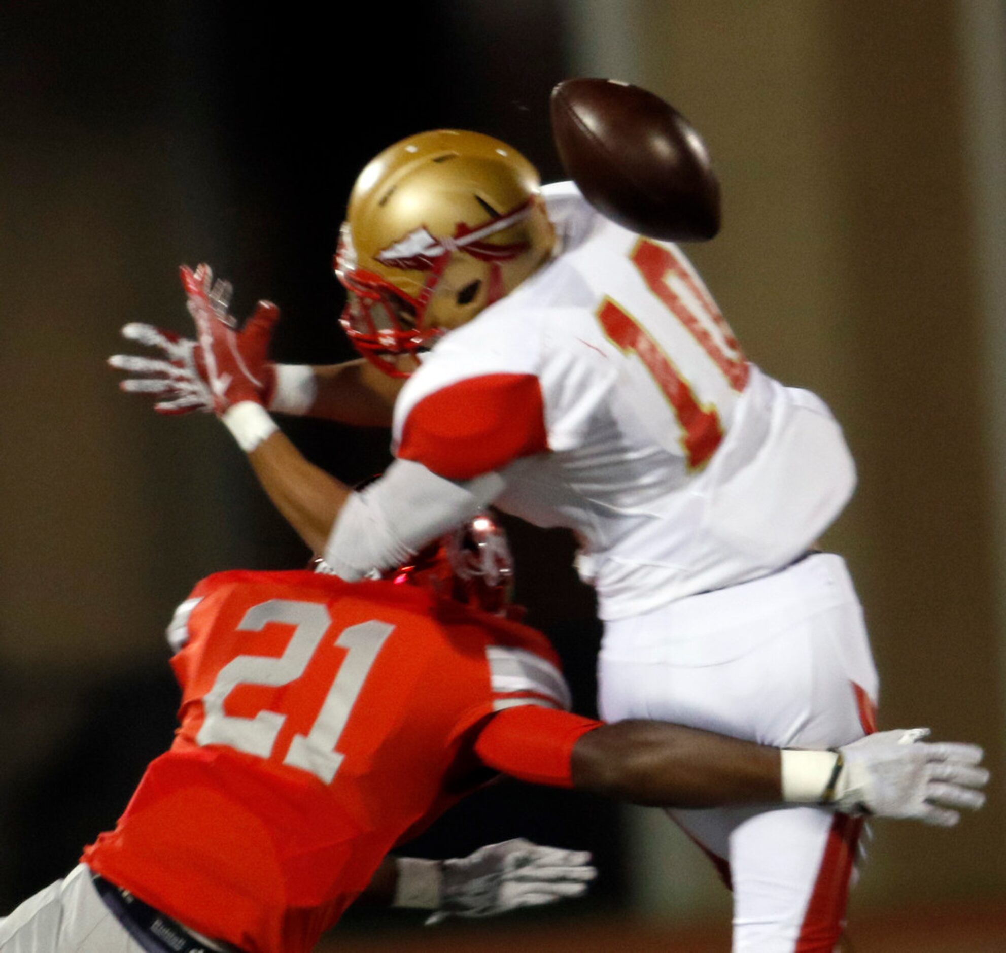 Duncanville defensive back Tre'Shon Devones (21) delivers a timely hit as the ball arrives...