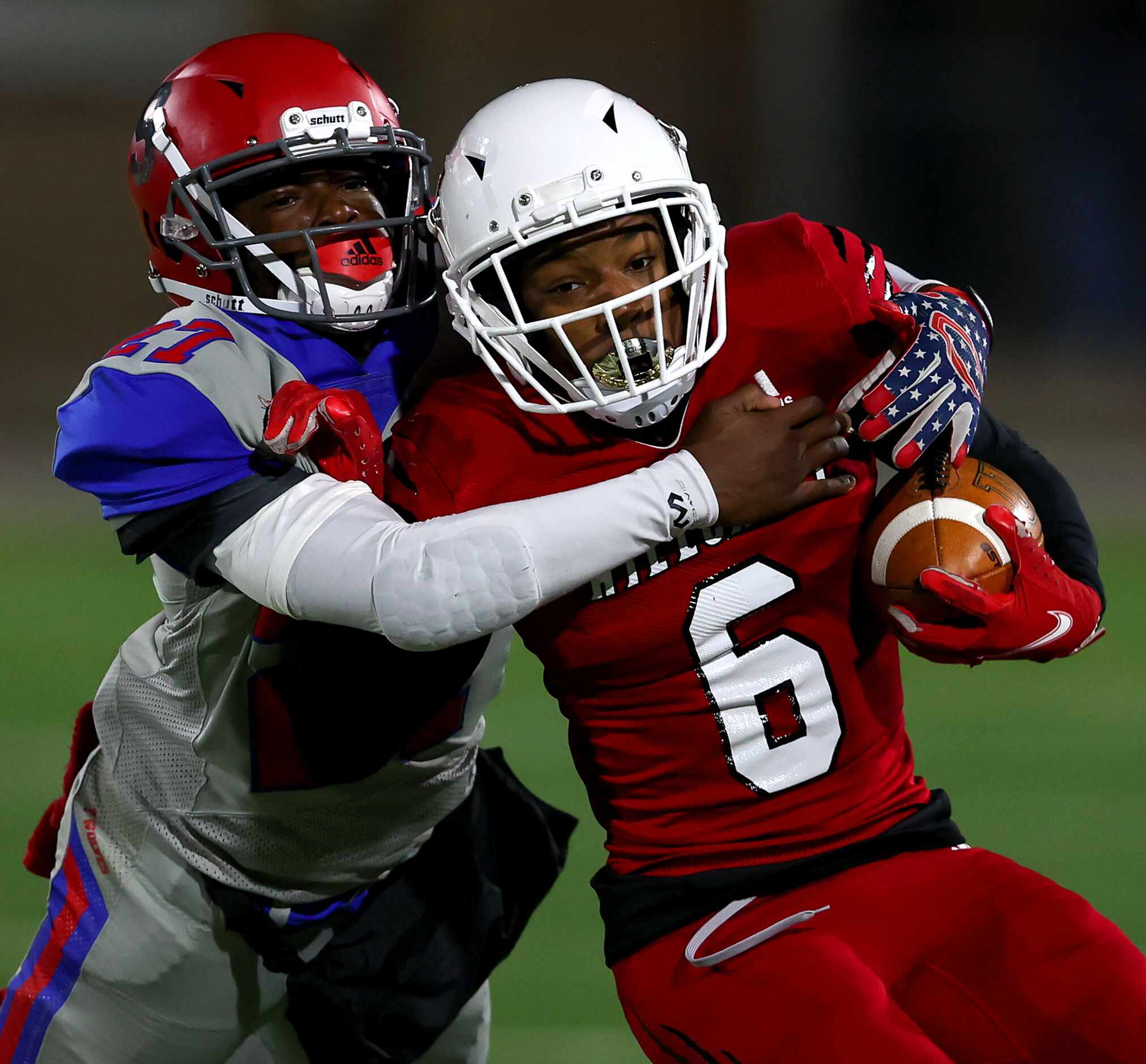 Hillcrest running back Jaden Hodge (6) is tackled on the play by Spruce linebacker Jayshawn...