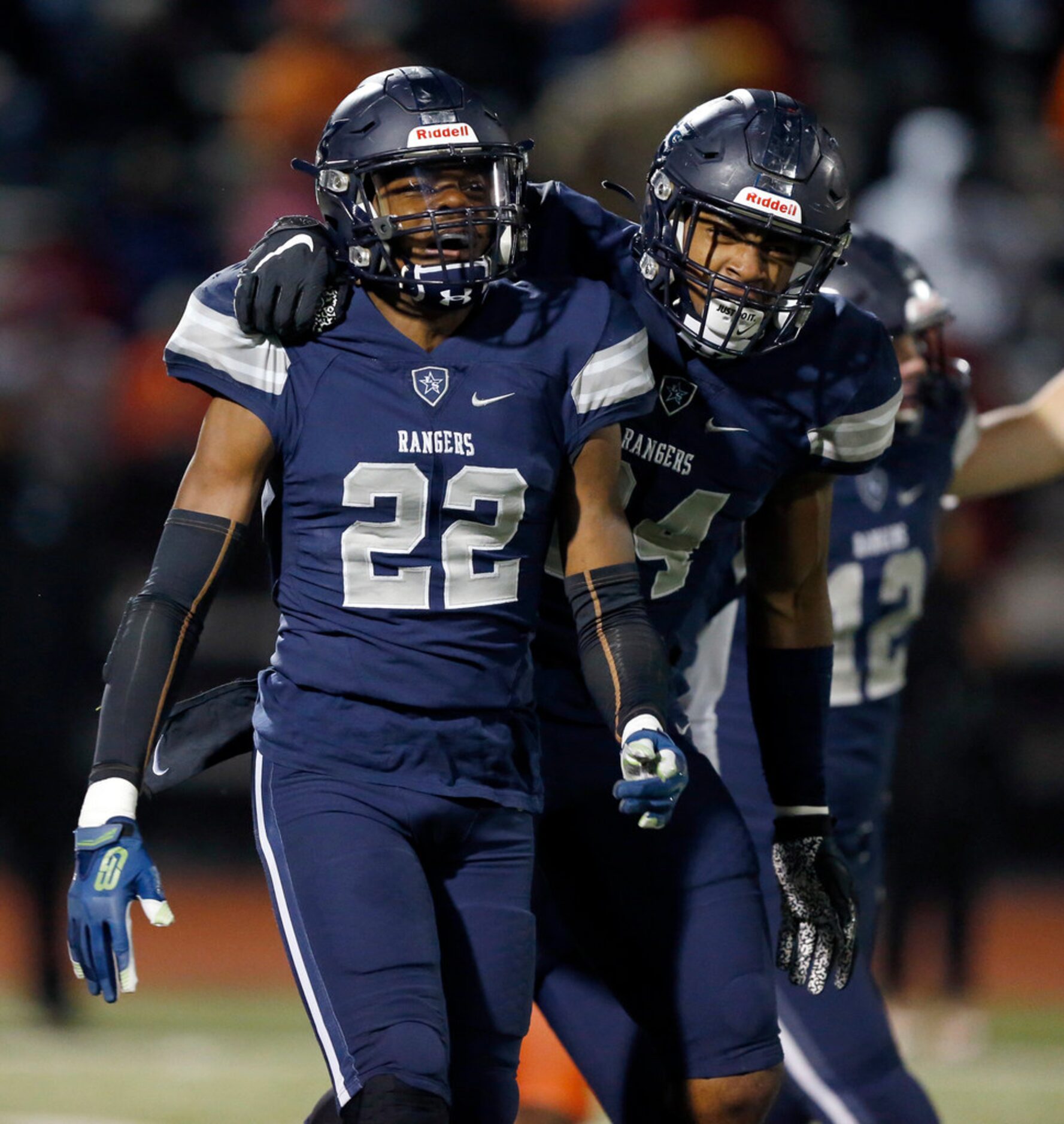 Frisco Lone Star defensive back Montrice Wrren (22) is congratulated by teammate Jaylan Ford...