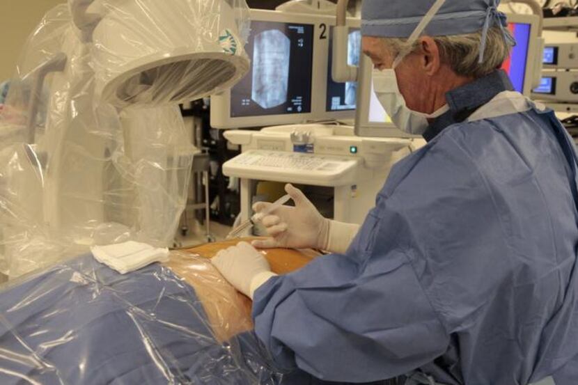 
A doctor from North American Spine performs minimally invasive spine surgery at Forest Park...