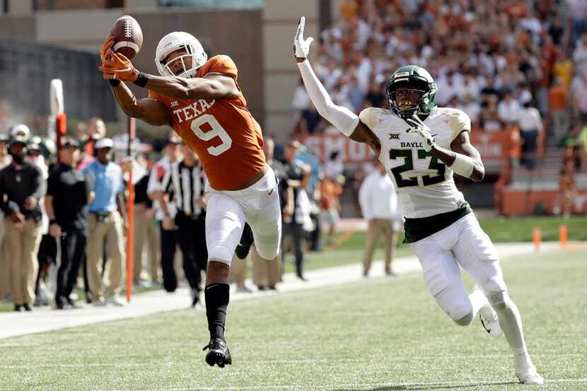 Texas wide receiver Collin Johnson (9) makes a catch in front of Baylor cornerback Derrek...