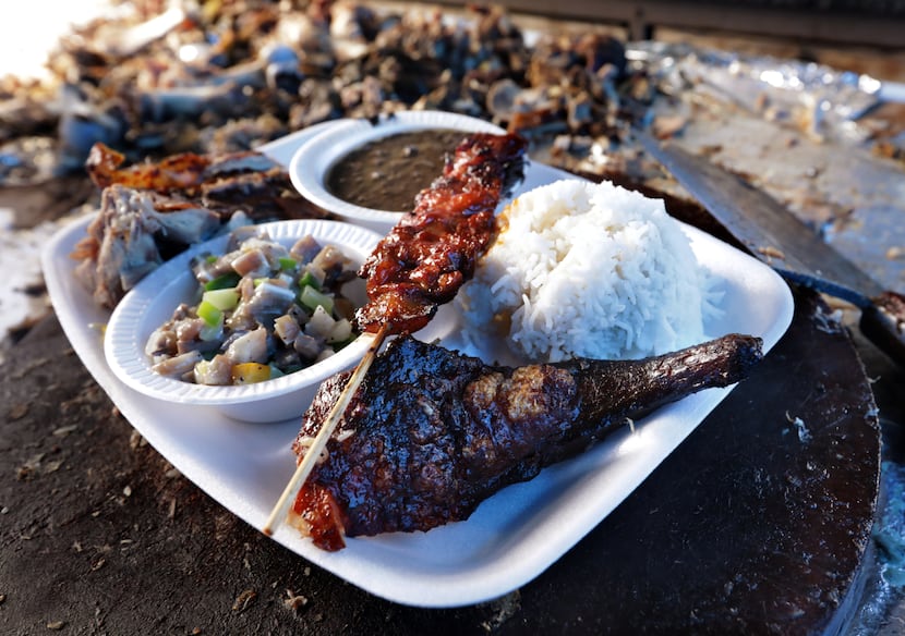 A combo plate full of meats and sides at Old Rooster Creek Filipino Asian/American BBQ in...