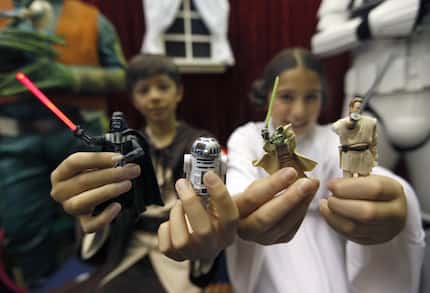 Pittsford,  N.Y.,  residents Chase Boss, left, 11, as Luke Skywalker and his twin sister,...