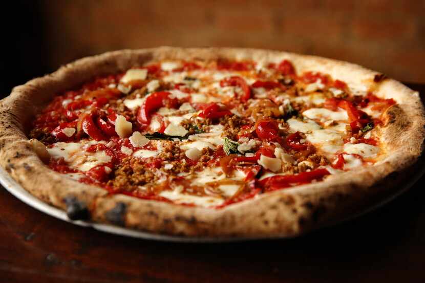Restaurant Review: The Cane Rosso pizza made with sausage, roasted onions and peppers at...