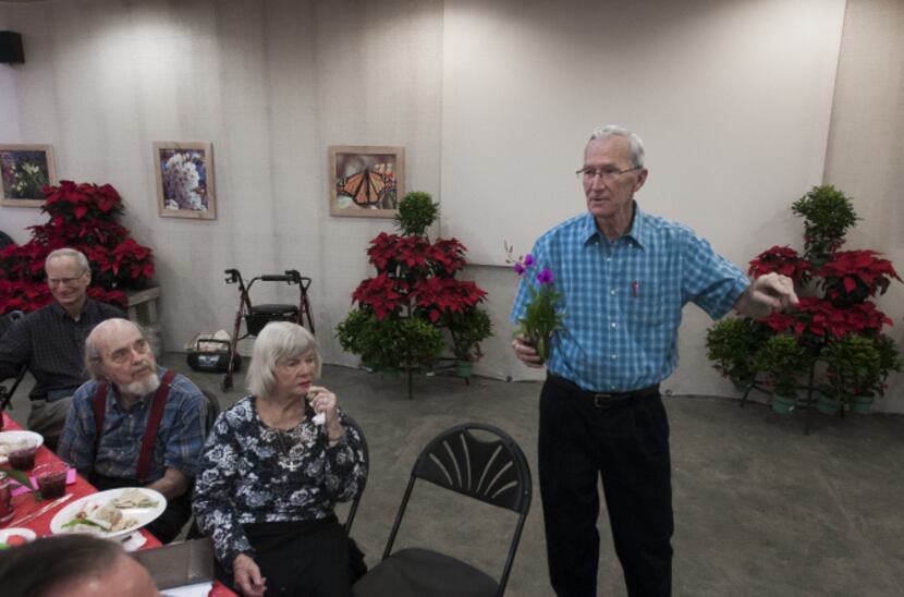 Jerry Brandenburg auctioned orchids at North Haven Gardens at the monthly meeting of the...