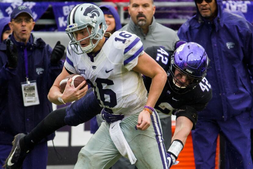 TCU Horned Frogs linebacker Ty Summers (42) tackles Kansas State Wildcats quarterback Jesse...