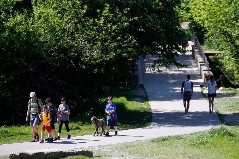 People make their way along the trail at Arbor Hills Nature Preserve, a 200 acre park in Plano.